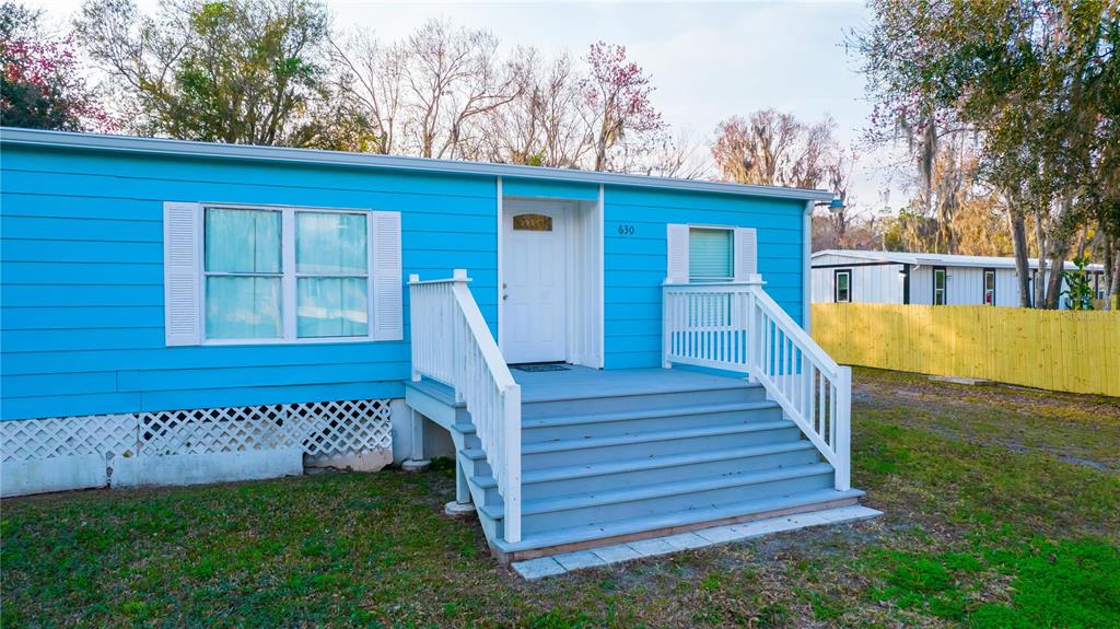 630 Carpenter Road Orlando, FL 32833 - Photo 3 of 23 a view of a house with wooden floor and a park