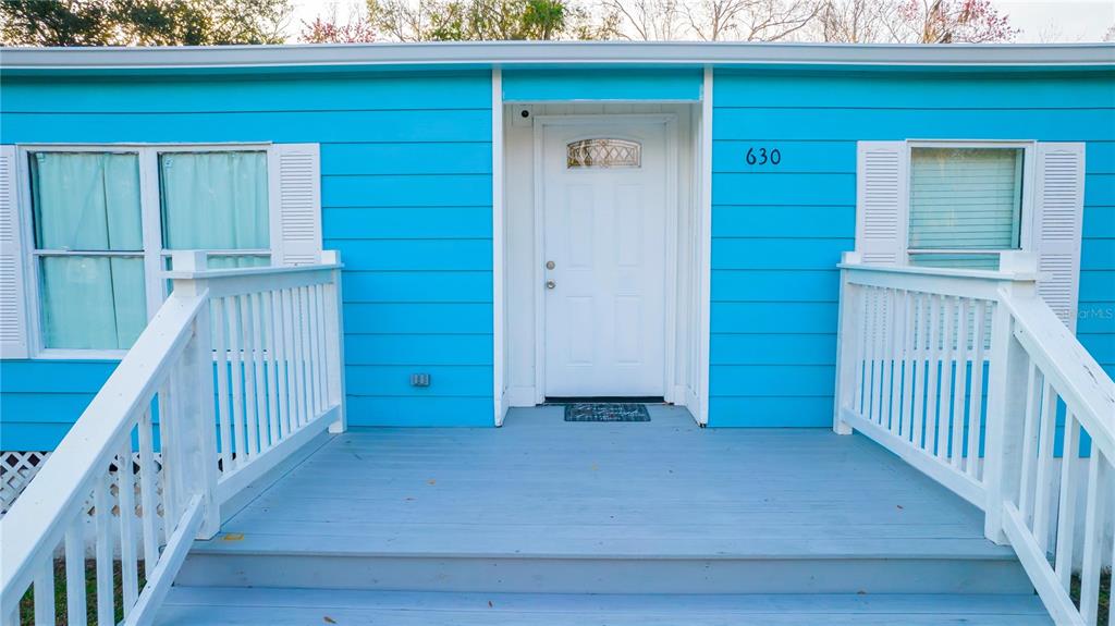 630 Carpenter Road Orlando, FL 32833 - Photo 4 of 23 a view of a house with wooden floor and fence
