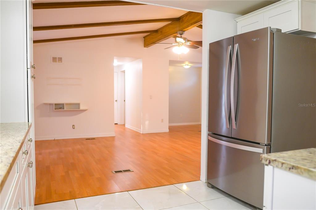 630 Carpenter Road Orlando, FL 32833 - Photo 7 of 23 a view of a kitchen with a refrigerator and a sink