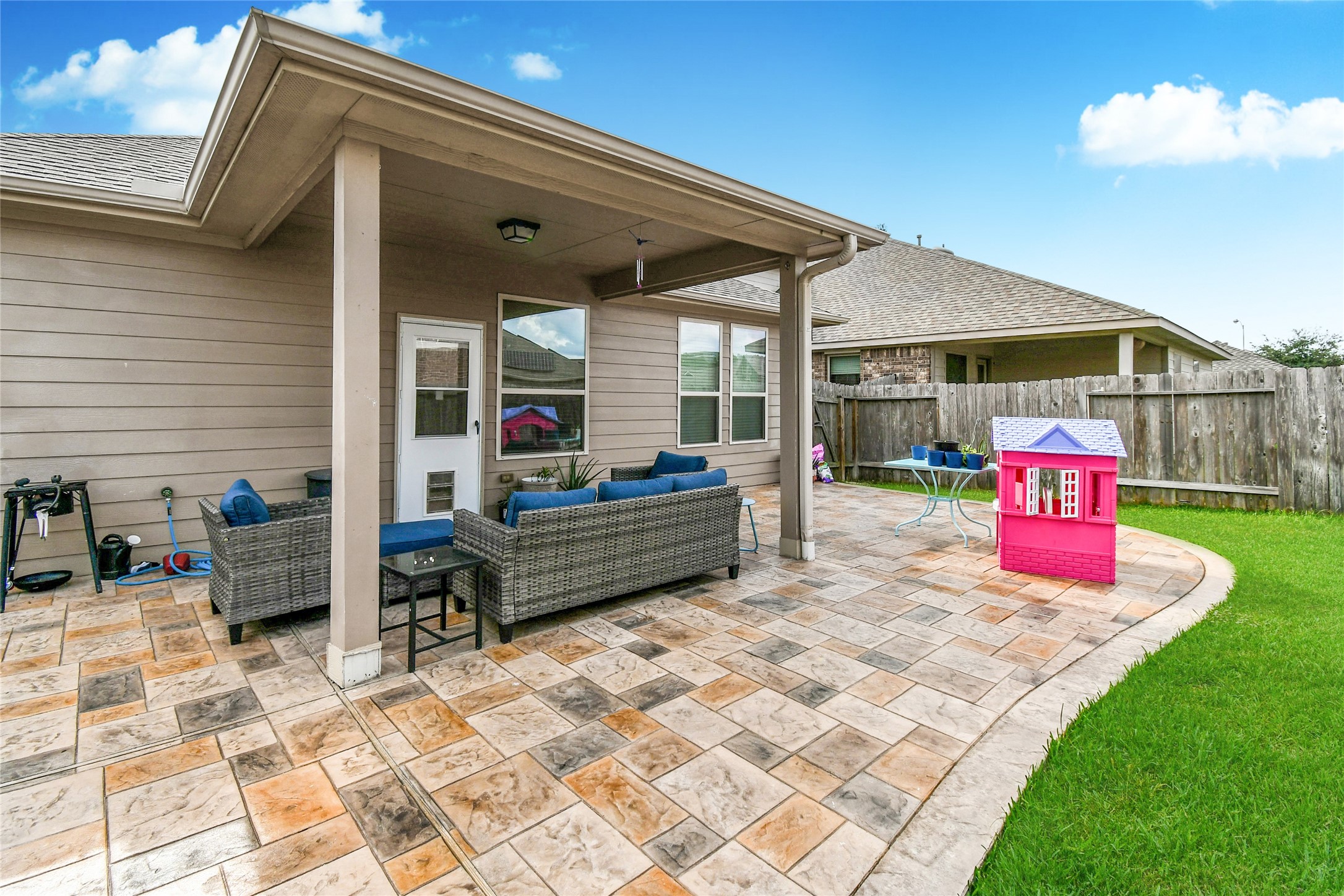 7110 Panther Ridge Drive Spring, TX 77389 - Photo 20 of 25 a patio area with table and chairs