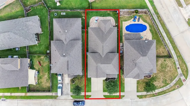 a front view of a house with yard and green space