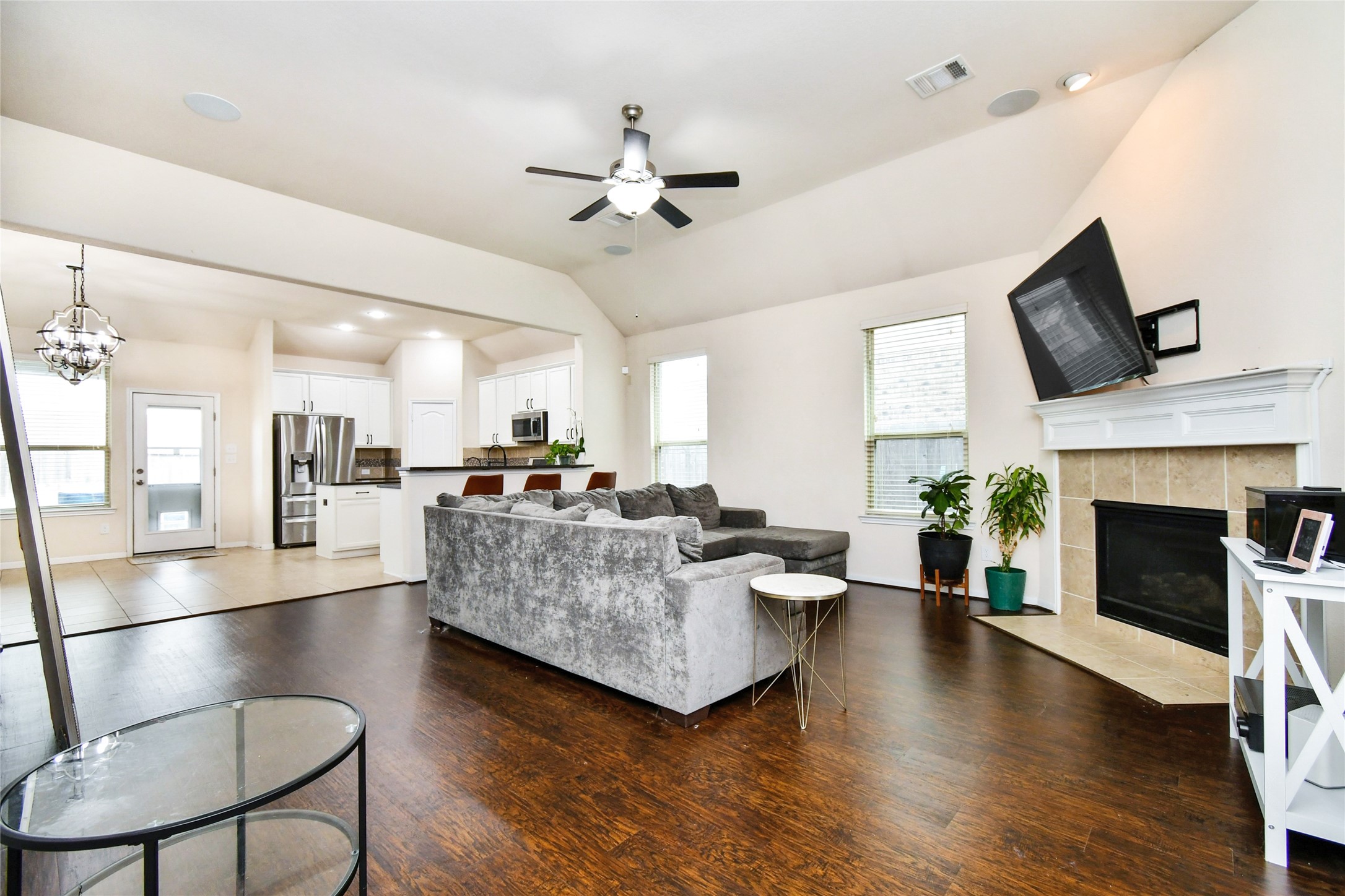 7110 Panther Ridge Drive Spring, TX 77389 - Photo 24 of 25 a living room with furniture fireplace and flat screen tv