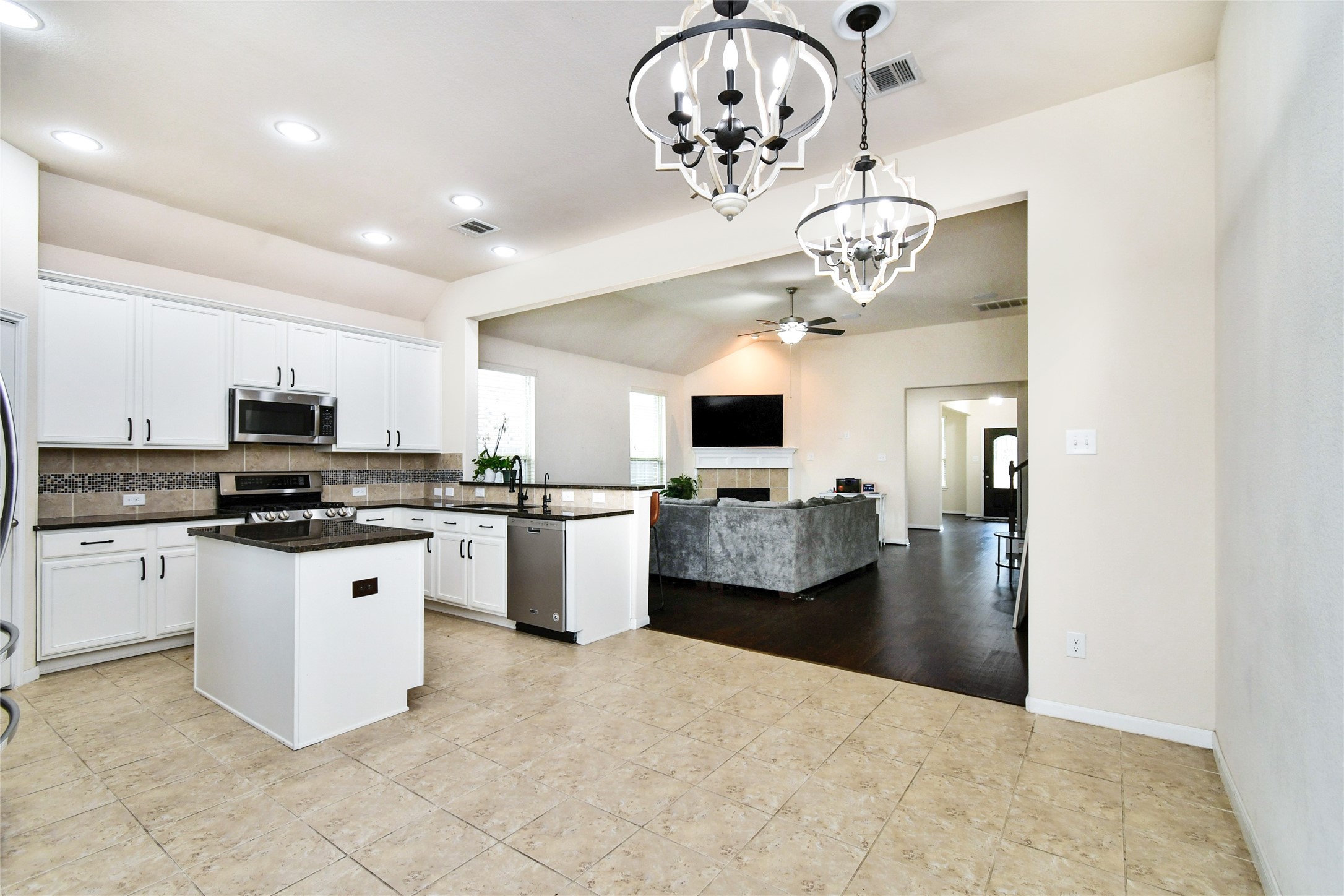 7110 Panther Ridge Drive Spring, TX 77389 - Photo 5 of 25 a large white kitchen with a window and stainless steel appliances