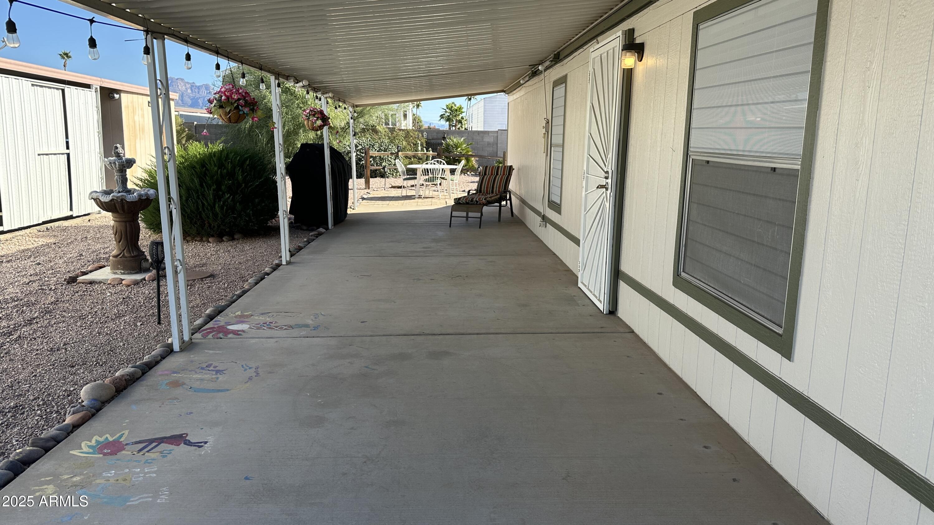 834 South Meridian Road, Unit 105 Apache Junction, AZ 85120 - Photo 42 of 48 a view of a porch with wooden floor and outdoor space