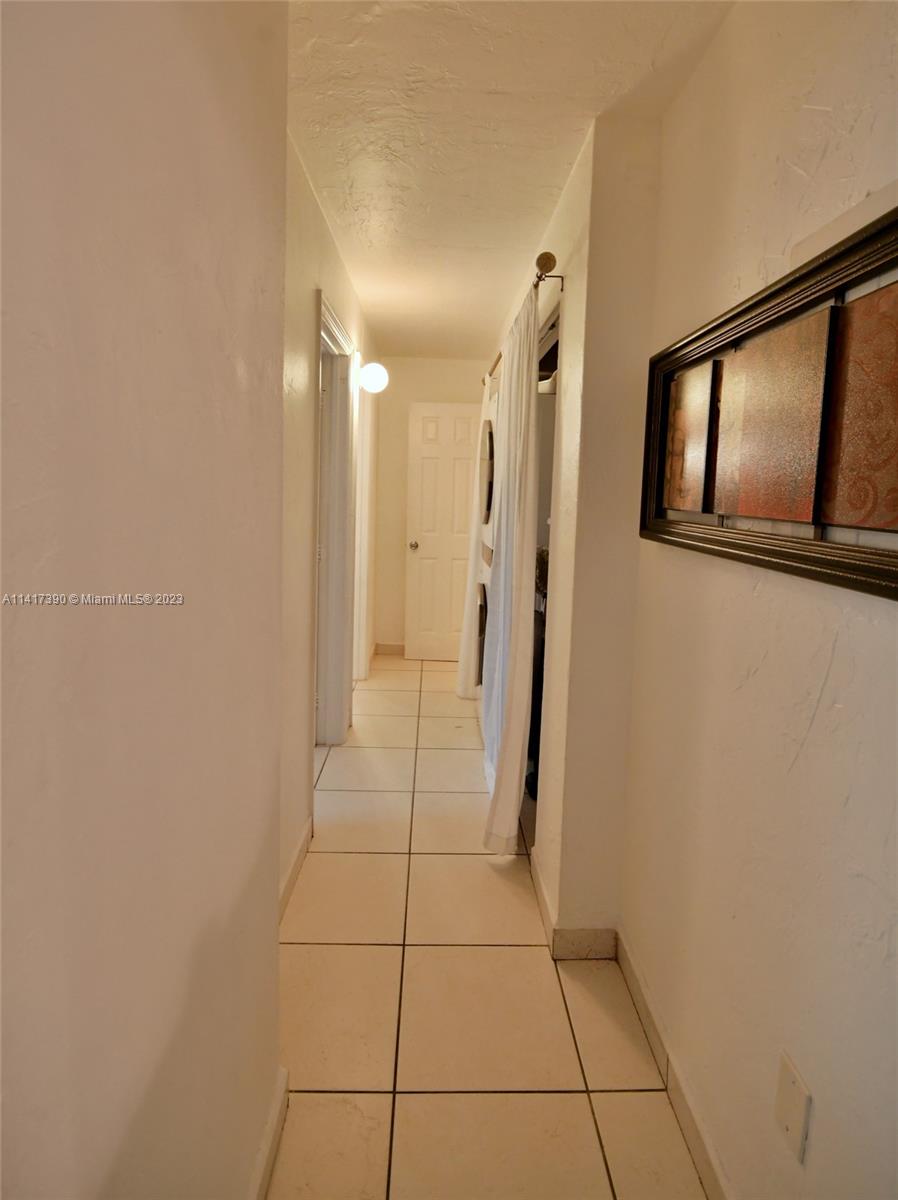 8609 Southwest 68th Court, Unit 5 Pinecrest, FL 33156 - Photo 15 of 27 a view of a hallway