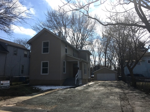 749 Spring Street Aurora, IL 60505 - Photo 1 of 18 a house with trees in the background