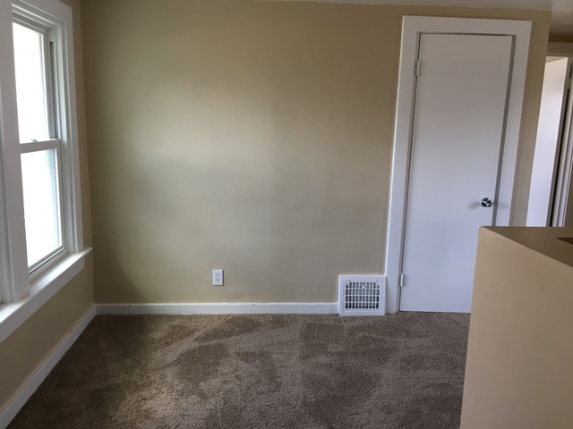 749 Spring Street Aurora, IL 60505 - Photo 11 of 18 an empty room with a workbench