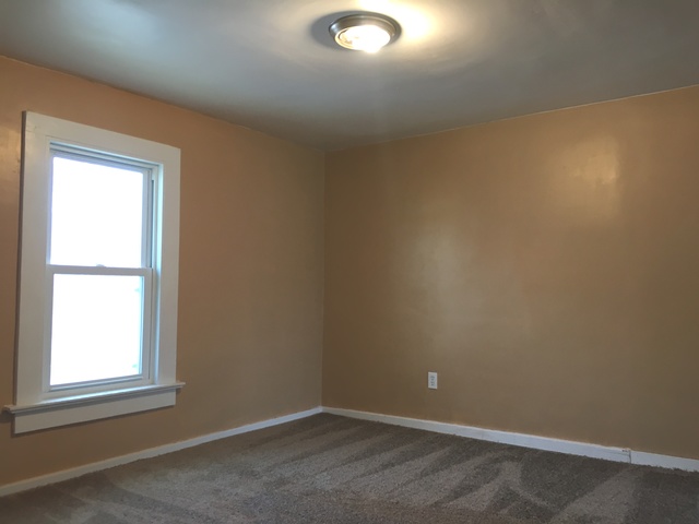 749 Spring Street Aurora, IL 60505 - Photo 13 of 18 an empty room with a window