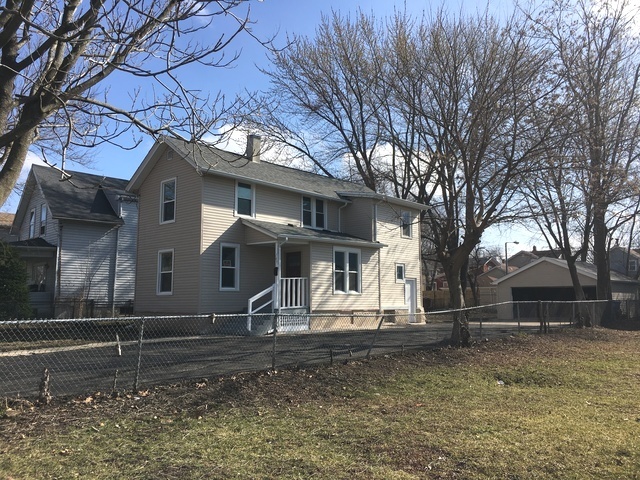 749 Spring Street Aurora, IL 60505 - Photo 3 of 18 a front view of a house with garden