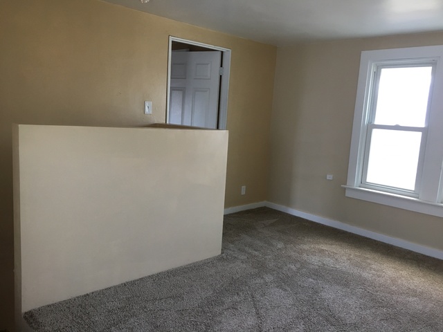 749 Spring Street Aurora, IL 60505 - Photo 10 of 18 an empty room with windows