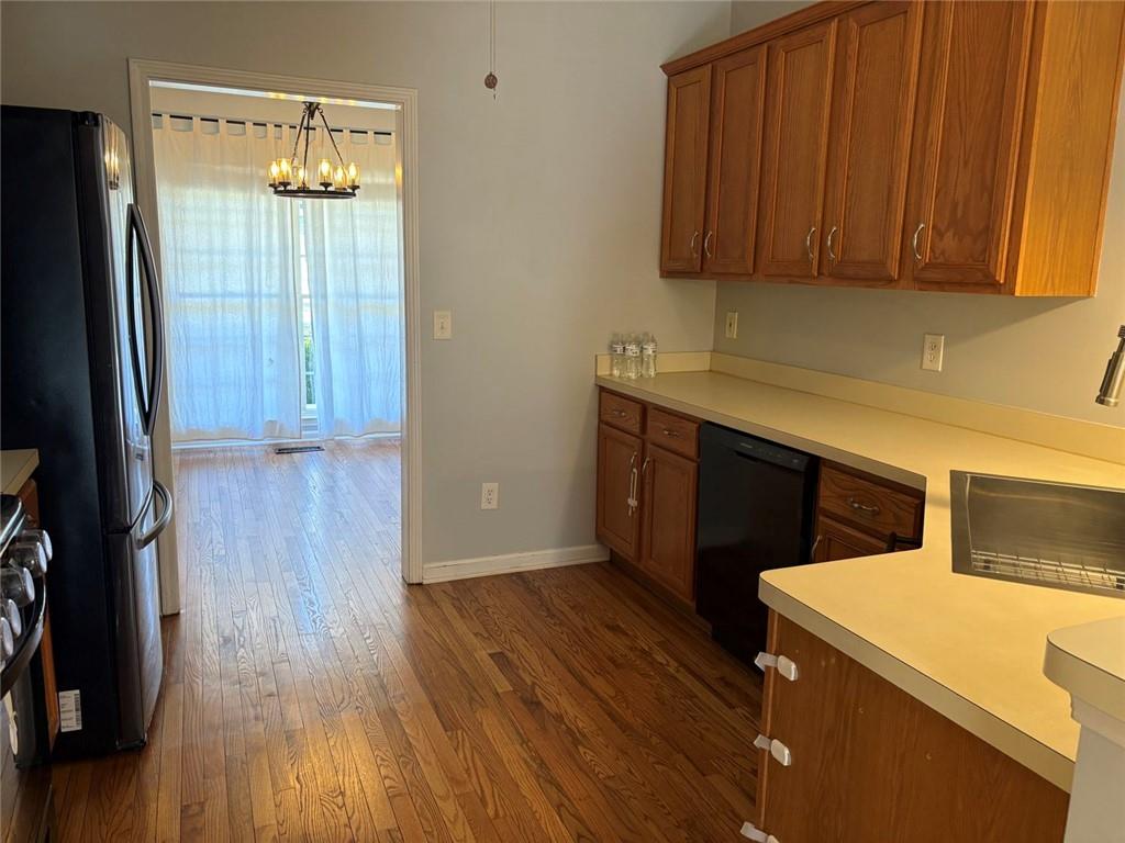 170 Blue Ridge Drive Powder Springs, GA 30127 - Photo 12 of 27 a kitchen with a wooden floor and a sink