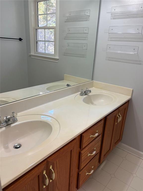 170 Blue Ridge Drive Powder Springs, GA 30127 - Photo 19 of 27 a bathroom with a sink and a mirror
