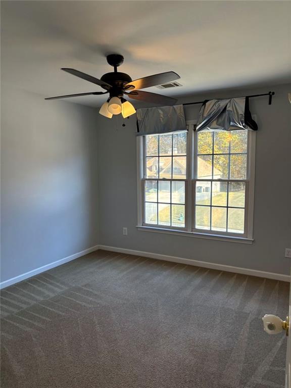 170 Blue Ridge Drive Powder Springs, GA 30127 - Photo 24 of 27 a view of room with a ceiling fan and window