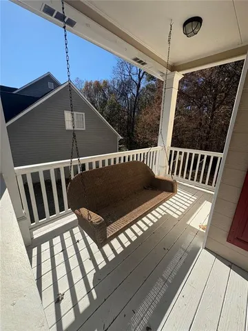a view of staircase with wooden floor and a window