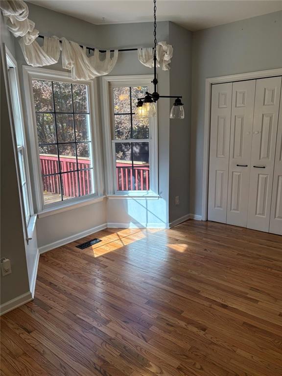 170 Blue Ridge Drive Powder Springs, GA 30127 - Photo 9 of 27 a view of empty room with wooden floor and fan