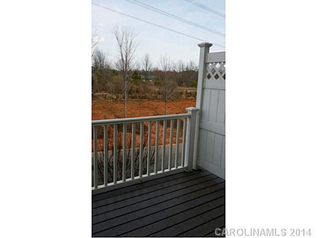 589 6th Baxter Crossing, Unit 5 Fort Mill, SC 29708 - Photo 7 of 12 a view of a balcony with wooden floor
