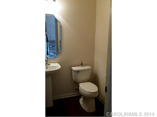 589 6th Baxter Crossing, Unit 5 Fort Mill, SC 29708 - Photo 8 of 12 a white toilet sitting next to a white sink