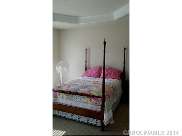 589 6th Baxter Crossing, Unit 5 Fort Mill, SC 29708 - Photo 10 of 12 a bedroom with a bed and a window