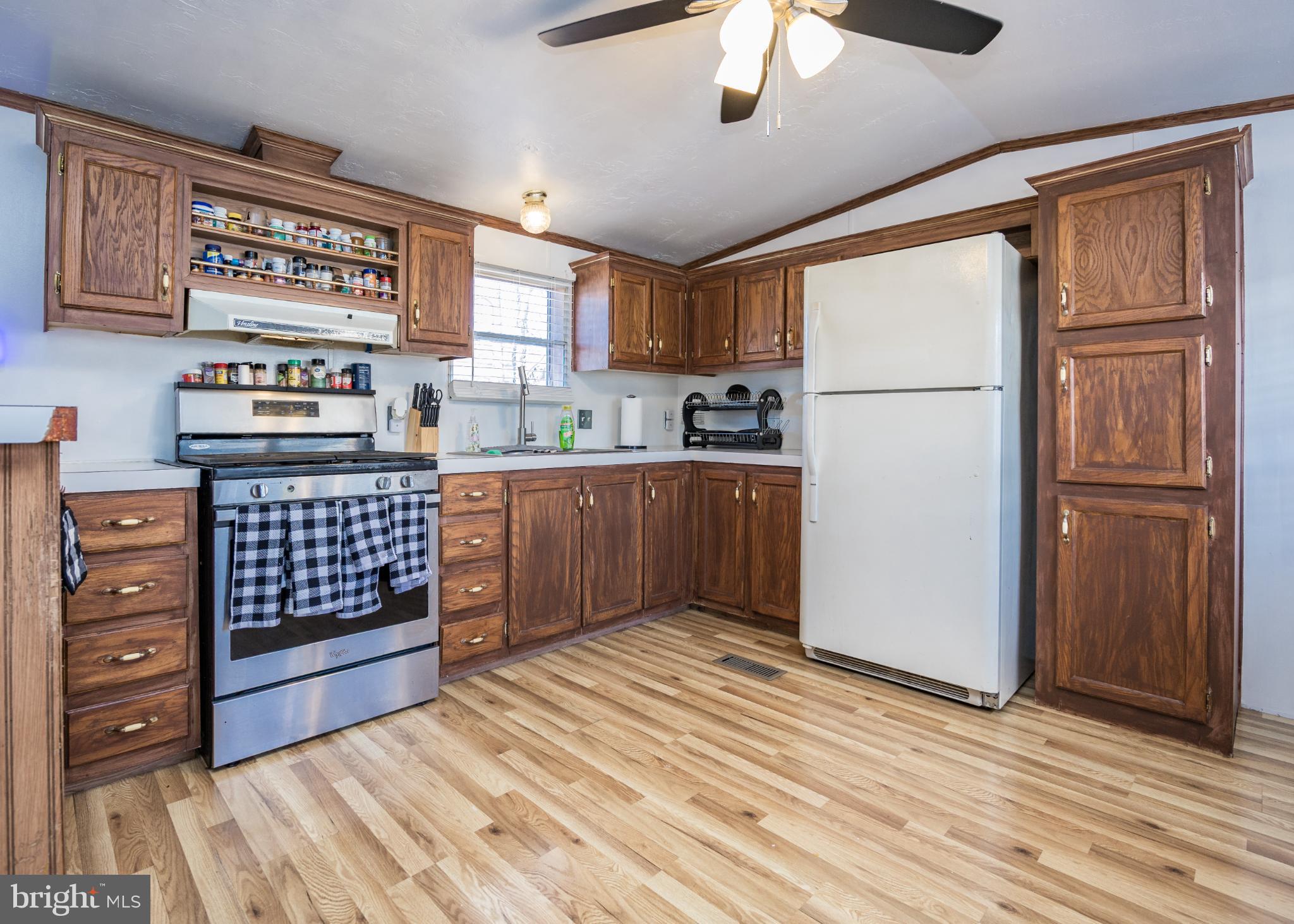 103 Herbert Court Bear, DE 19701 - Photo 15 of 33 a kitchen with stainless steel appliances granite countertop a refrigerator and a stove top oven