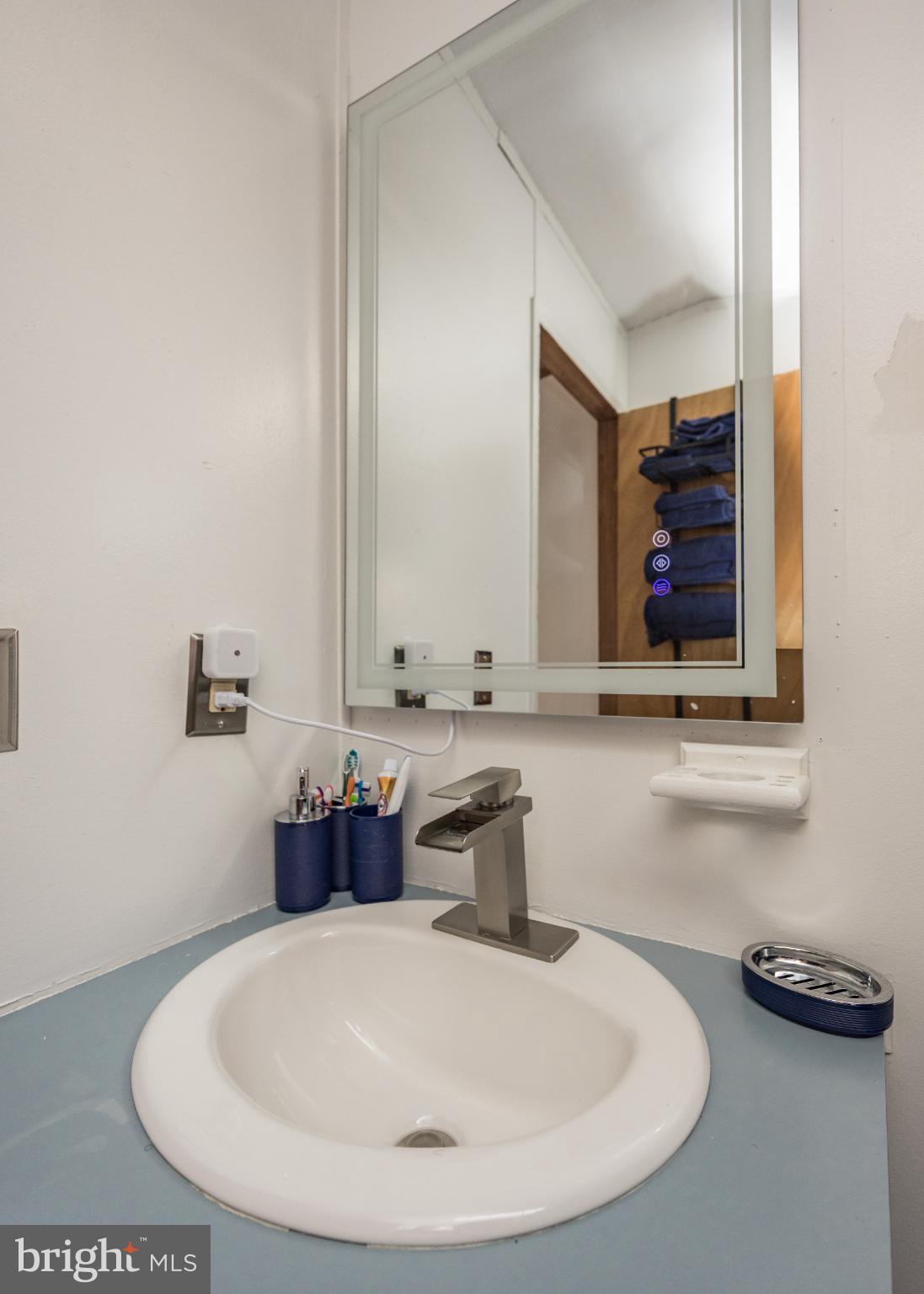 103 Herbert Court Bear, DE 19701 - Photo 25 of 33 a bathroom with a sink and a mirror