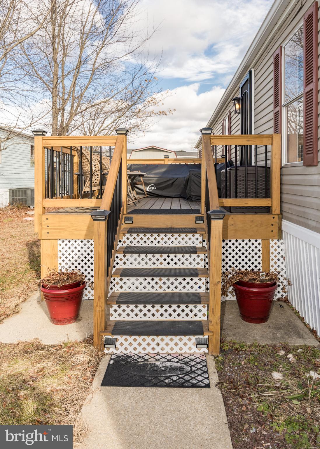 103 Herbert Court Bear, DE 19701 - Photo 3 of 33 a view of a patio with a table and chairs