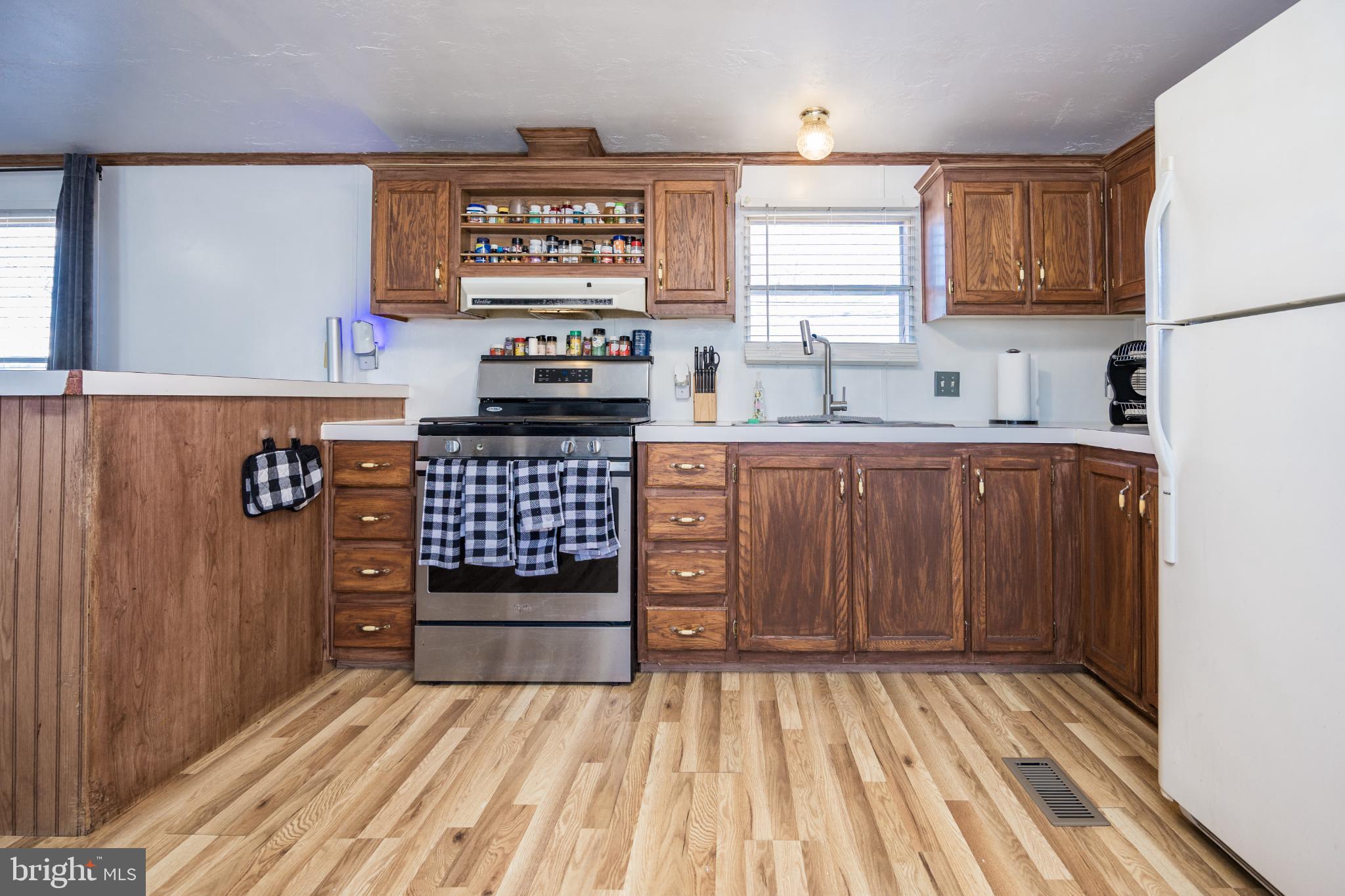 103 Herbert Court Bear, DE 19701 - Photo 8 of 33 a kitchen with stainless steel appliances a stove and cabinets