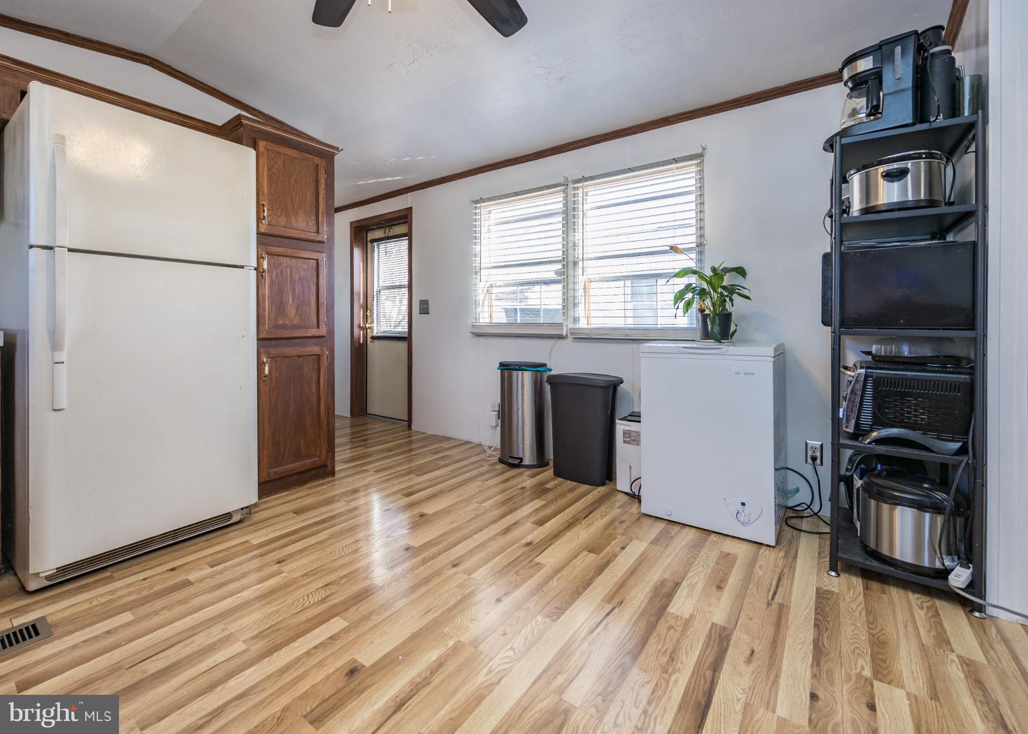103 Herbert Court Bear, DE 19701 - Photo 9 of 33 a view of kitchen with furniture and refrigerator