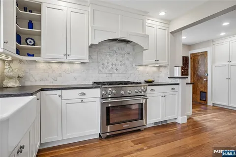 a living room filled with furniture and a window