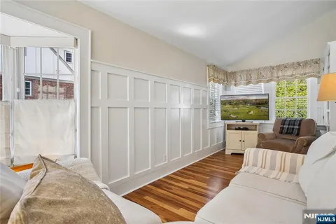 a bedroom with a bed and a potted plant