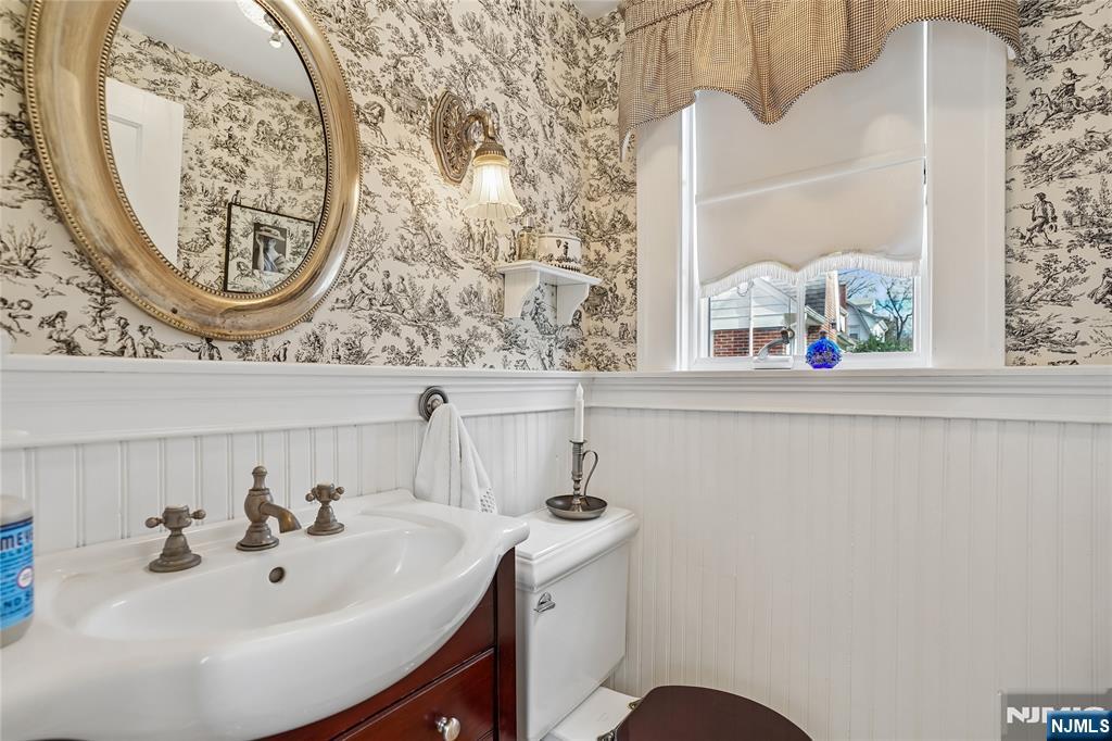 25 Bowers Road Caldwell, NJ 07006 - Photo 16 of 37 a bathroom with a sink and a mirror