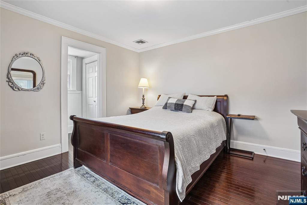 25 Bowers Road Caldwell, NJ 07006 - Photo 17 of 37 a bedroom with a bed and a potted plant