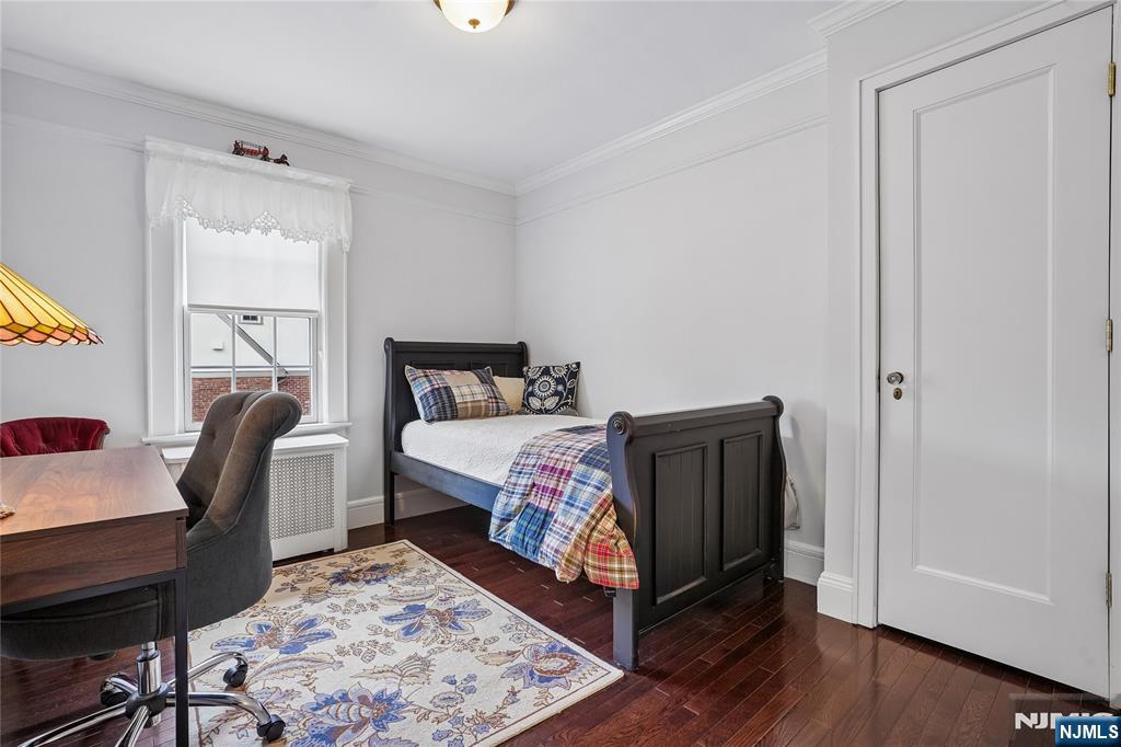 25 Bowers Road Caldwell, NJ 07006 - Photo 19 of 37 a bedroom with a bed and wooden floor