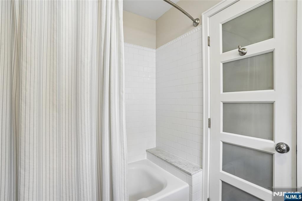 25 Bowers Road Caldwell, NJ 07006 - Photo 22 of 37 a bathroom with a bathtub