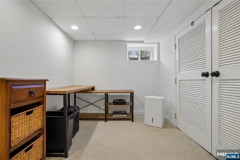 a view of a yard with large trees