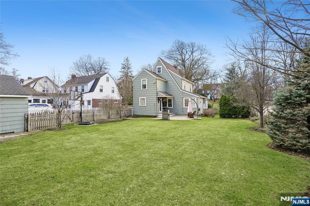 25 Bowers Road Caldwell, NJ 07006 - Photo 29 of 37 a view of a big house with a big yard and large trees