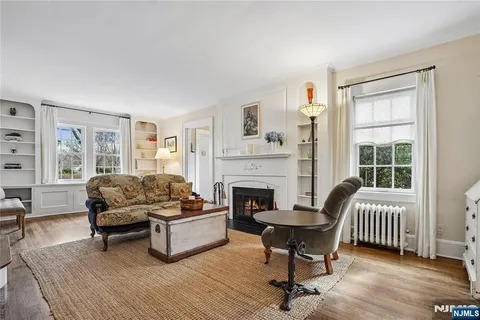 a view of a a dining room with furniture wooden floor and chandelier