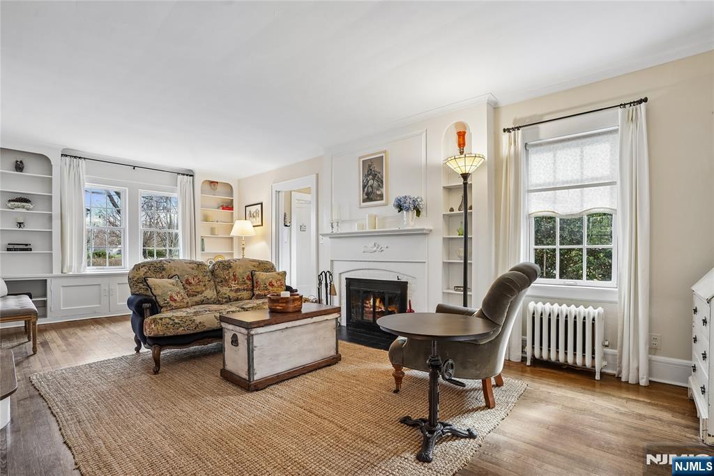 25 Bowers Road Caldwell, NJ 07006 - Photo 5 of 37 a living room with furniture and a fireplace