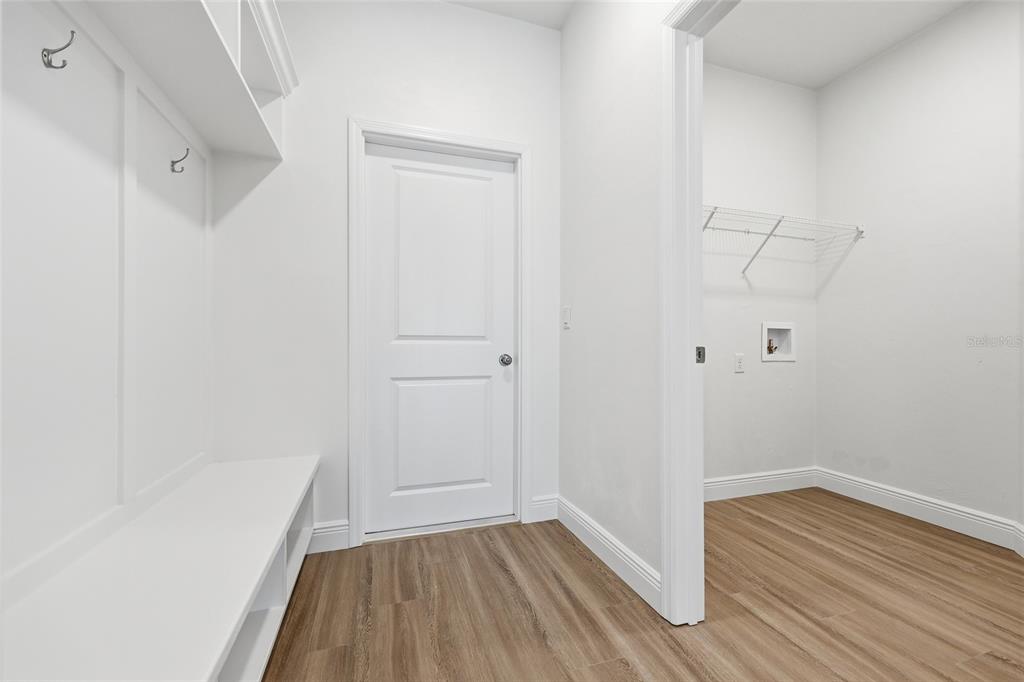 6735 Southwest 10th Lane Gainesville, FL 32607 - Photo 18 of 24 a view of a room with wooden floor and white walls