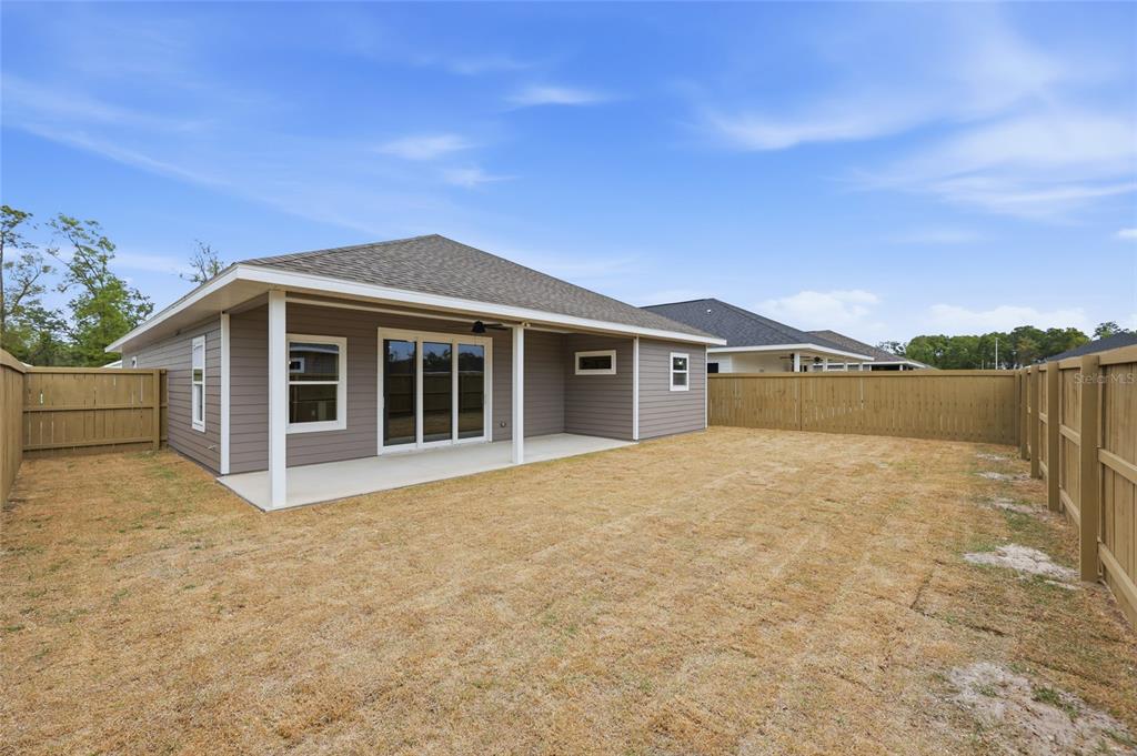 6735 Southwest 10th Lane Gainesville, FL 32607 - Photo 20 of 24 a view of an house with backyard space and a lake view