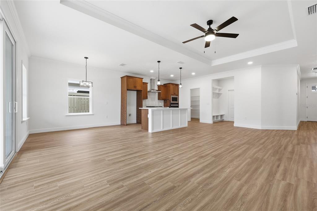 6735 Southwest 10th Lane Gainesville, FL 32607 - Photo 6 of 24 a view of a kitchen with a sink and a refrigerator