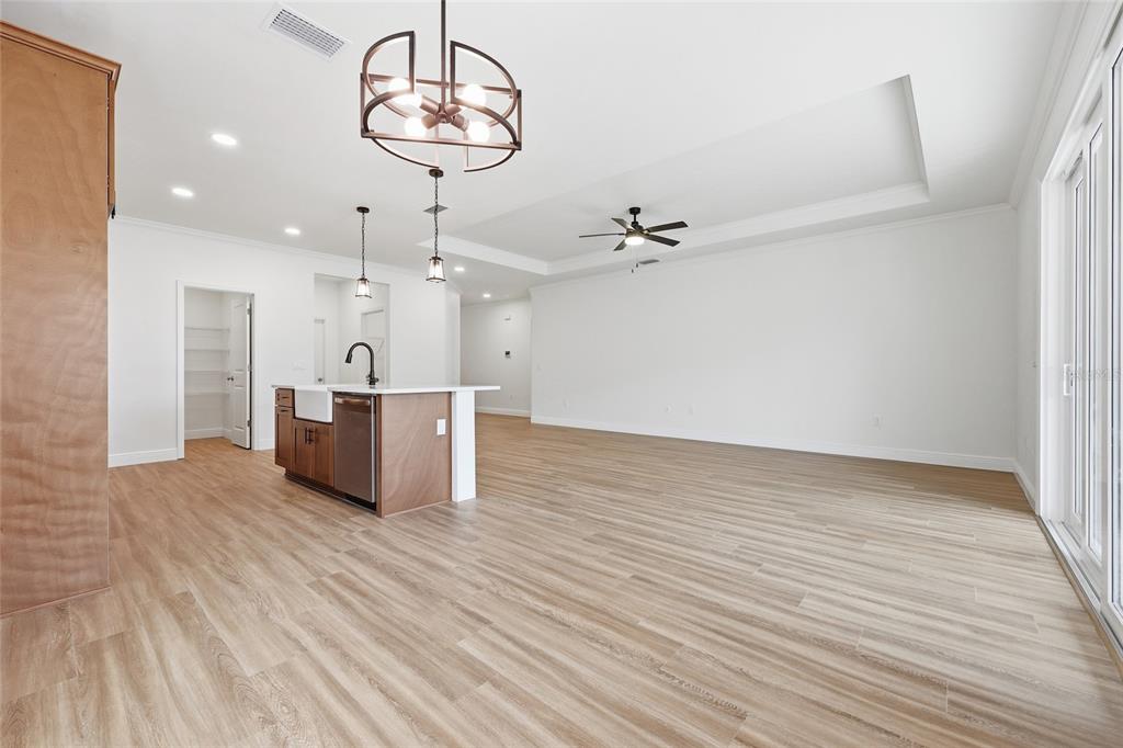 6735 Southwest 10th Lane Gainesville, FL 32607 - Photo 9 of 24 a view of a kitchen with a sink and wooden floor