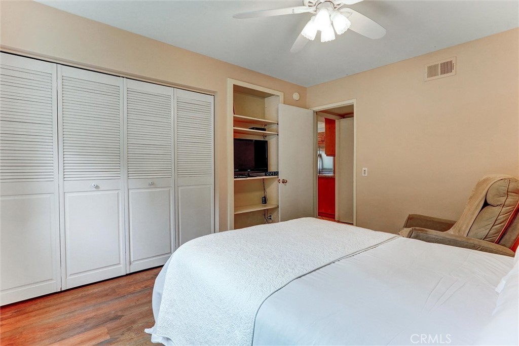 19238 Castlebay Lane Porter Ranch, CA 91326 - Photo 16 of 38 a bedroom with a bed and a chandelier