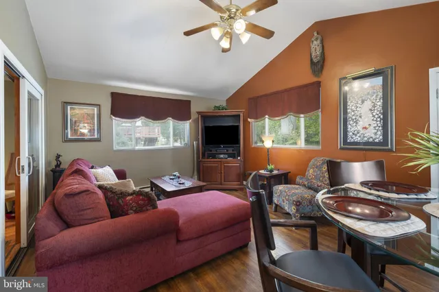 a living room with furniture fireplace and a flat screen tv