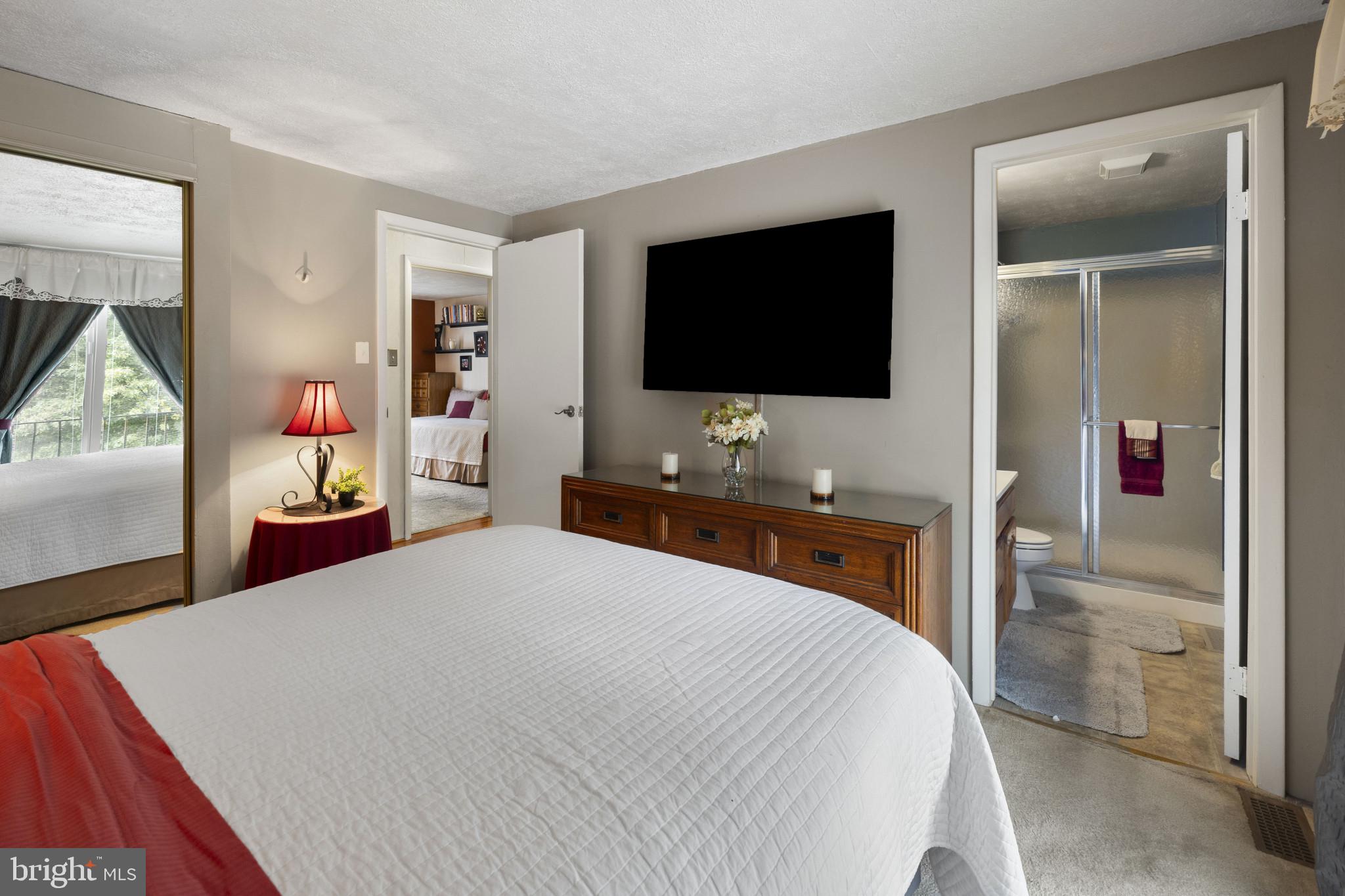 4105 Hanwell Road Randallstown, MD 21133 - Photo 20 of 37 a bedroom with a bed and a flat screen tv