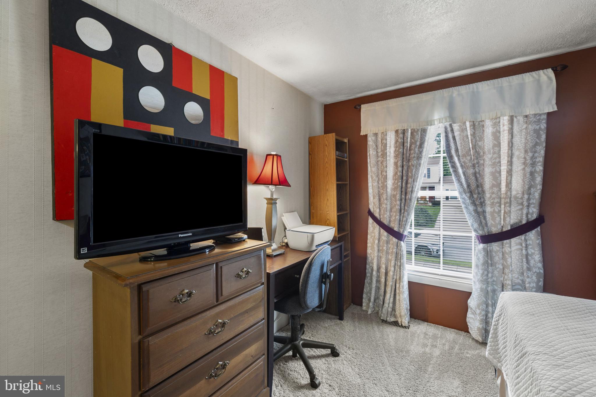 4105 Hanwell Road Randallstown, MD 21133 - Photo 22 of 37 a living room with furniture and a flat screen tv