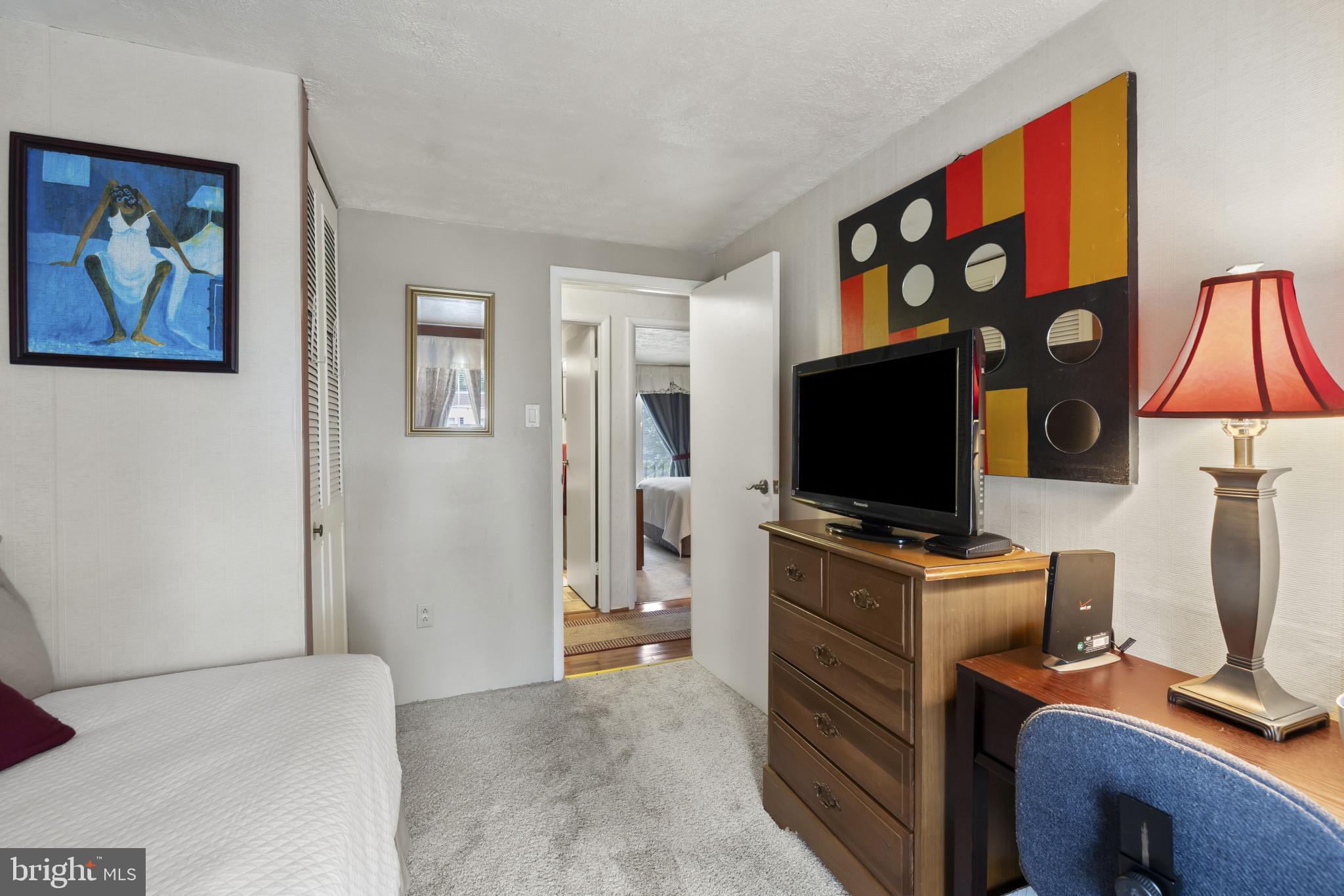 4105 Hanwell Road Randallstown, MD 21133 - Photo 23 of 37 a view of a livingroom with workspace and a flat screen tv