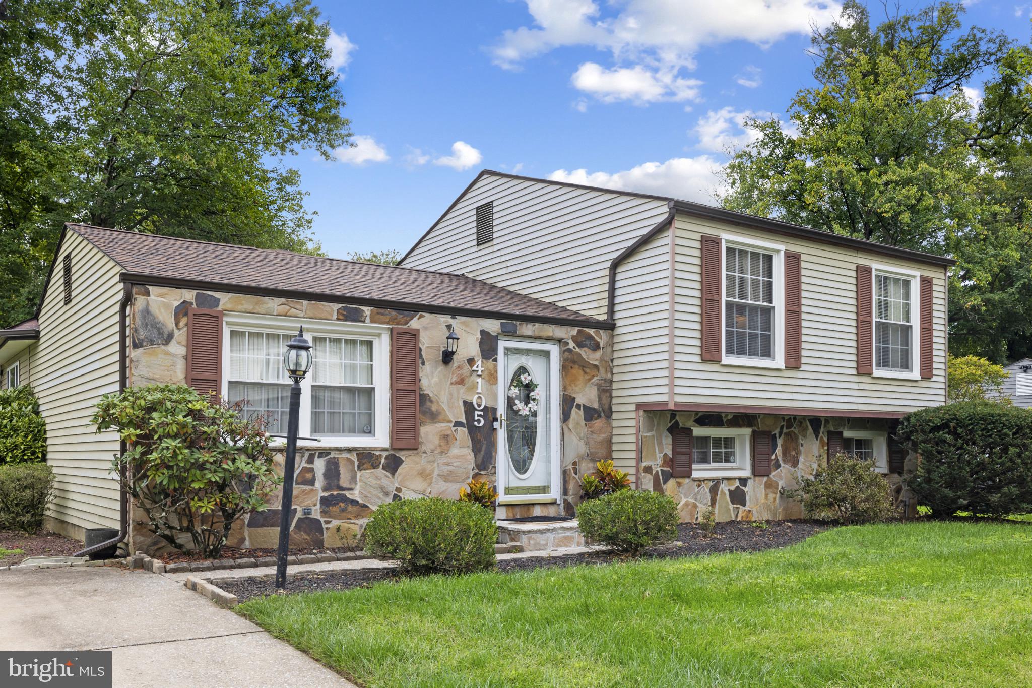 4105 Hanwell Road Randallstown, MD 21133 - Photo 37 of 37 a front view of a house with a garden and plants