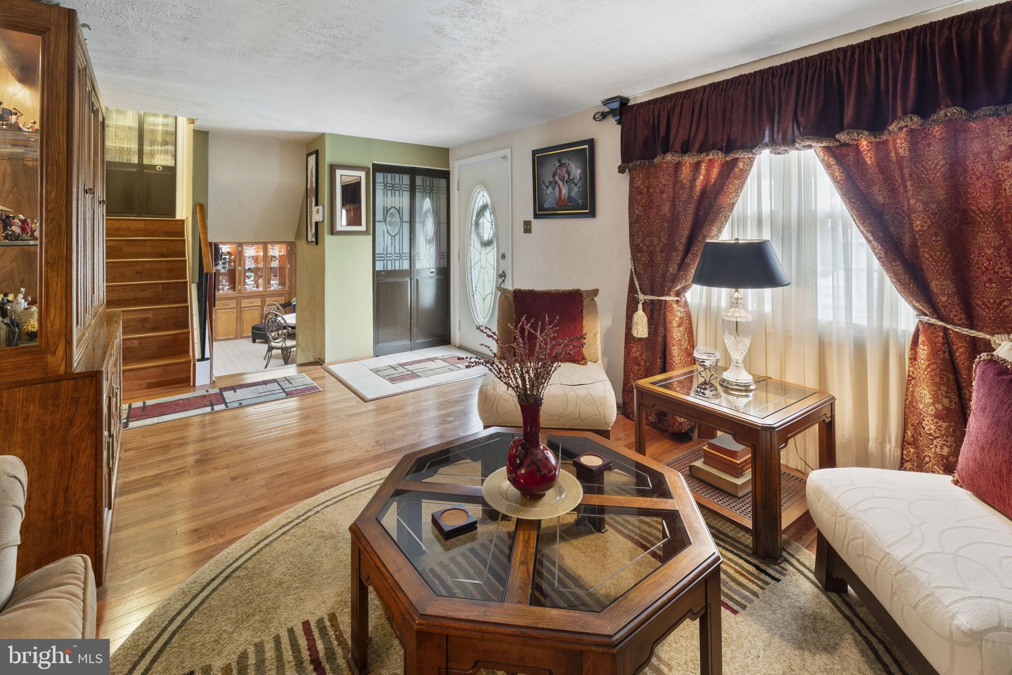 4105 Hanwell Road Randallstown, MD 21133 - Photo 4 of 37 a living room with furniture and a wooden floor