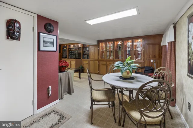 a view of a dining room with furniture and window