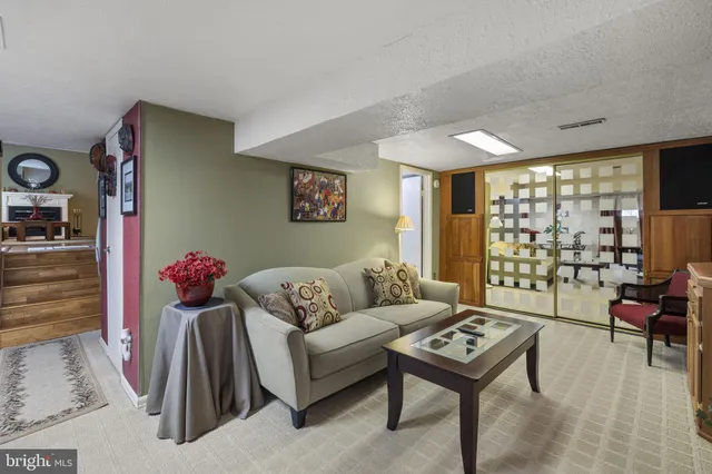 a living room with furniture and a table